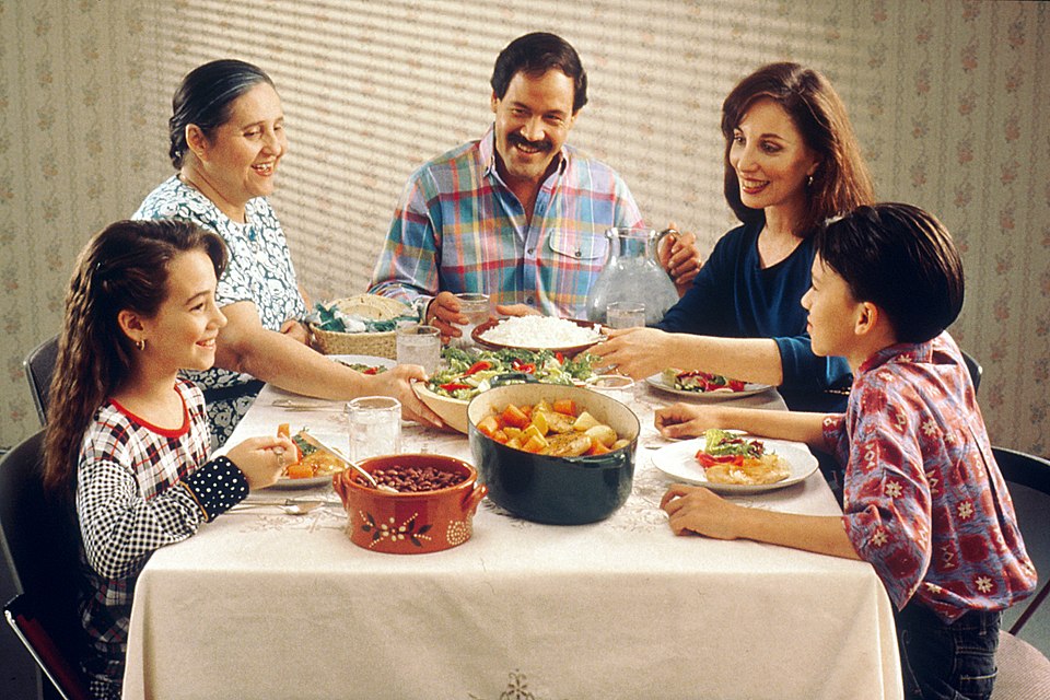 A family enjoying a meal together at the dinner table